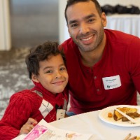 Christopher poses with son